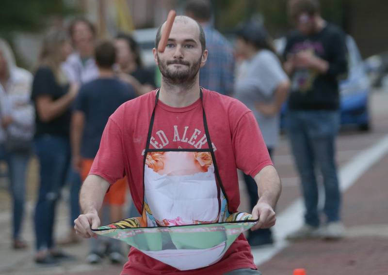Luke Marselle of Princeton, eyes the sausage while playing the sausage toss game during the Oktoberfest event on Saturday, Oct. 18, 2025 at Rotary Park in Princeton.