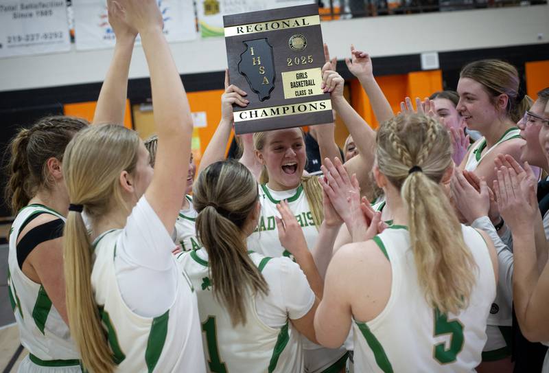 Seneca's Lainie Olson, center, celebrates with her teammates after defeating Manteno in the IHSA Class 2A Beecher regional Friday, Feb. 21, 2025.