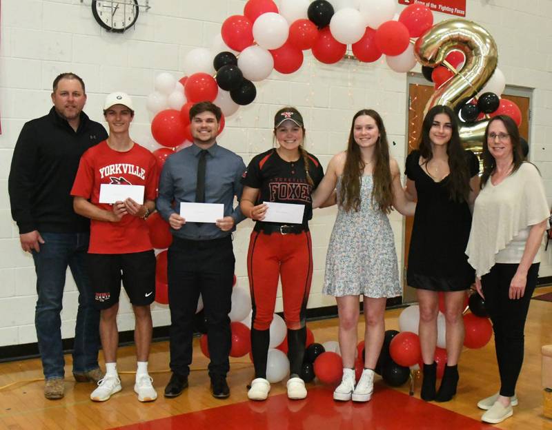 Pictured from left are scholarship committee member Justin Fisher, CARSTAR; YHS award recipients Logan Brusak, Nicholas Childs, Katlyn Schraeder, Wrigley Glenn and Athena Westphal; and Renee Tortorella, Yorkville Area Chamber of Commerce president.