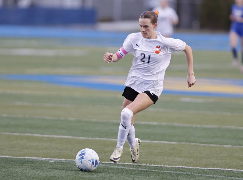 Wheaton Warrenville South's Ashlyn Adams (21) handles the ball during the girl's varsity soccer match between Lyons Township and Wheaton Warrenville South high schools on Thursday, March 27, 2025 in Western Springs.