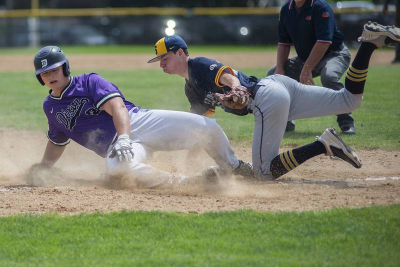 Dixon’s Mikey Bivins is tagged out at third by Sterling’s Trevor Saturday, May 28, 2022.