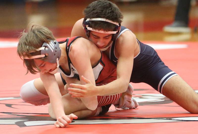 Lisle's Sebastian Lara wrestels Streators Brody Sliker during a meet on Wednesday, Jan. 21, 2025 in Pops Dale Gymnasium at Streator High School.