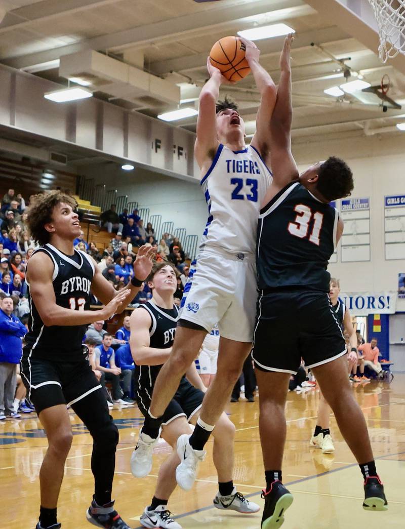 Princeton's Noah LaPorte scores over Byron's Kaden McGought Saturday night at Prouty Gym. PHS won 53-51.