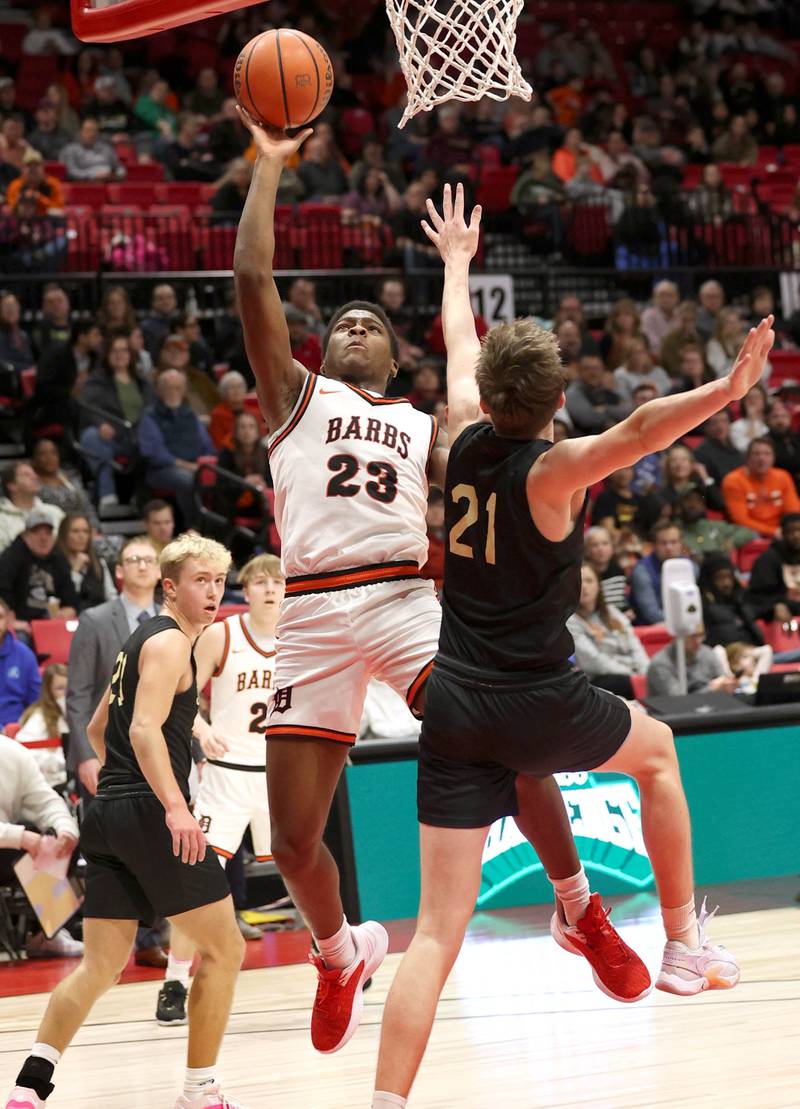 DeKalb’s Davon Grant looks to score over Sycamore's Ben Larry Friday, Jan. 26, 2024, during the FNBO Challenge in the Convocation Center at Northern Illinois University.