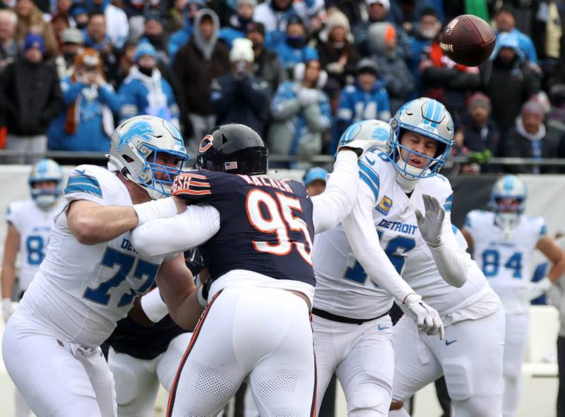 Chicago Bears defensive end DeMarcus Walker pressures Detroit Lions quarterback Jared Goff as he releases the ball during their game Sunday, Dec. 22, 2024, at Soldier Field in Chicago.