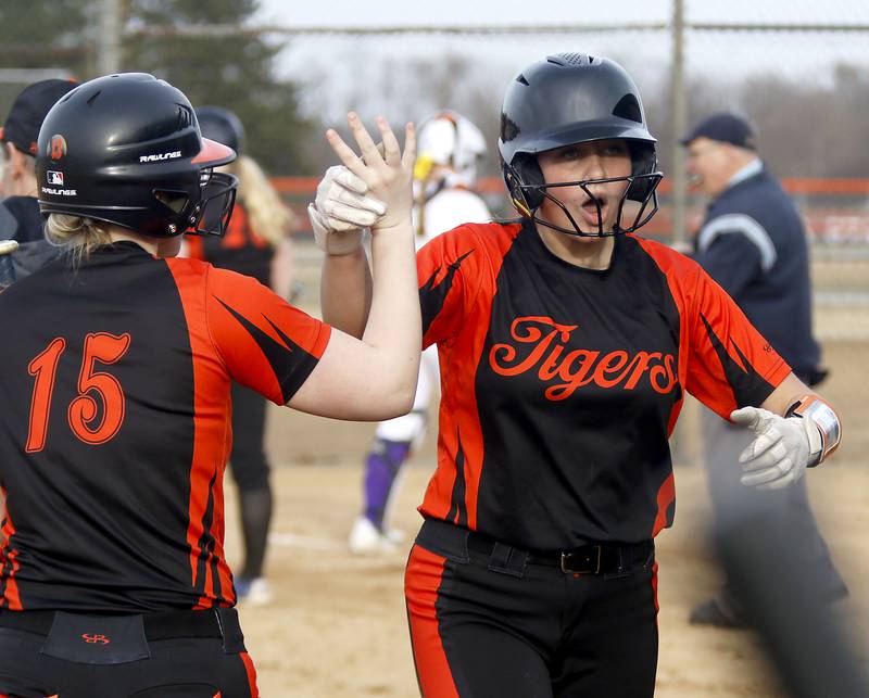 Crystal Lake Central's Oli Victorine celebrates scoring a run with teammate, Kylie Gibbons, during a nonconference softball game against Wauconda on Friday, March 20, 2026, at Crystal Lake Central High School.