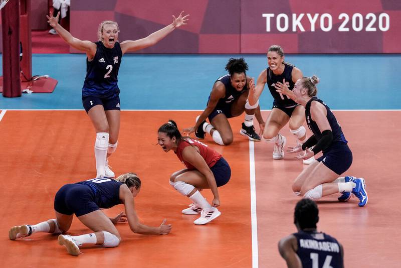 United States players celebrate after winning the women's volleyball semifinal match between Serbia and United States at the 2020 Summer Olympics, Friday, Aug. 6, 2021, in Tokyo, Japan.