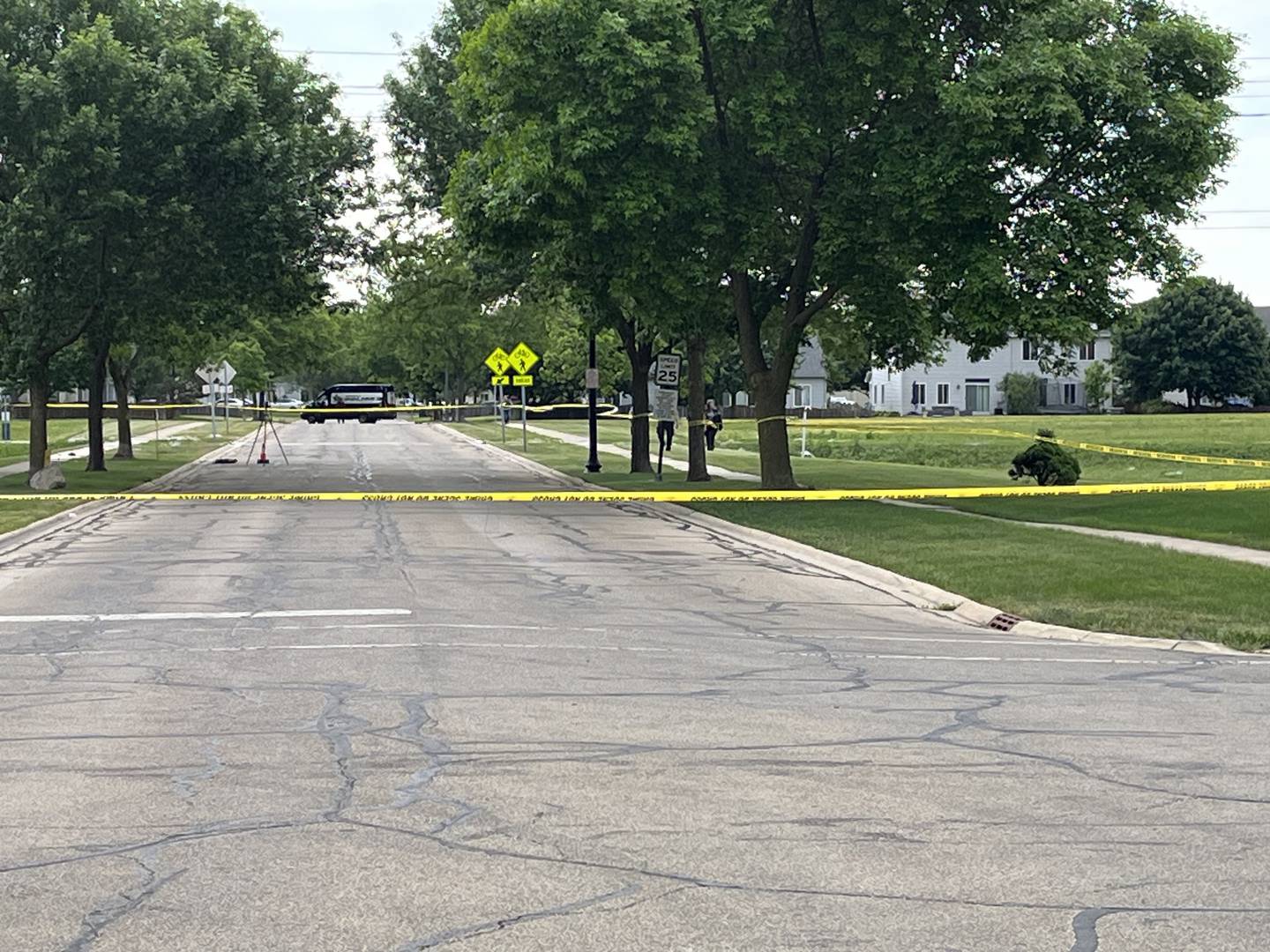A taped off area of Sierra Trail, just east of Summerfield Drive, on Thursday, May 26, 2023. A Romeoville police officer was shot in the shoulder during the apprehension of suspect in a stolen motor vehicle incident.