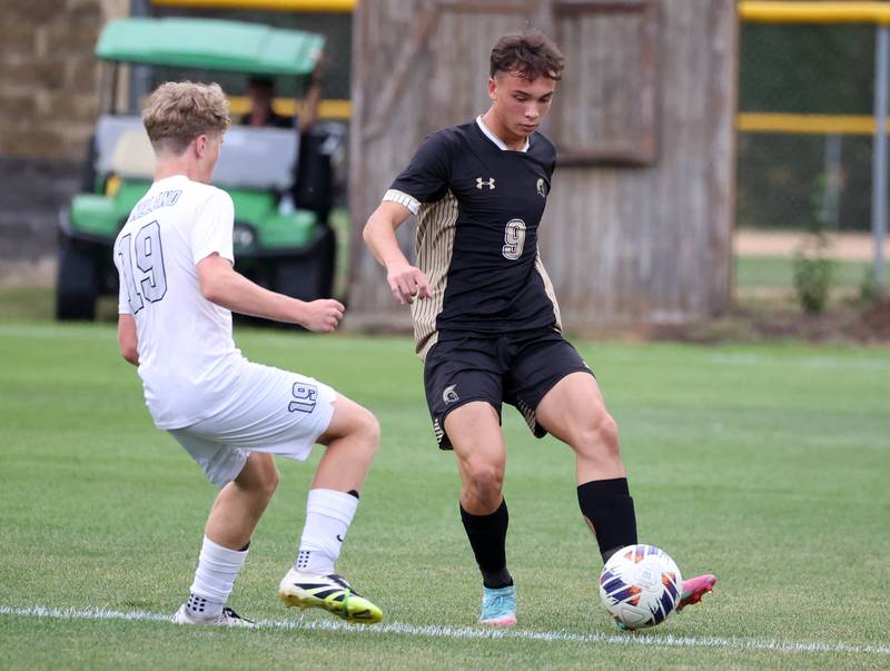 Sycamore's Felix Arends passes the ball around Kaneland's Isaac Stoltzner during their game Monday, Oct. 6, 2025, at Sycamore High School.