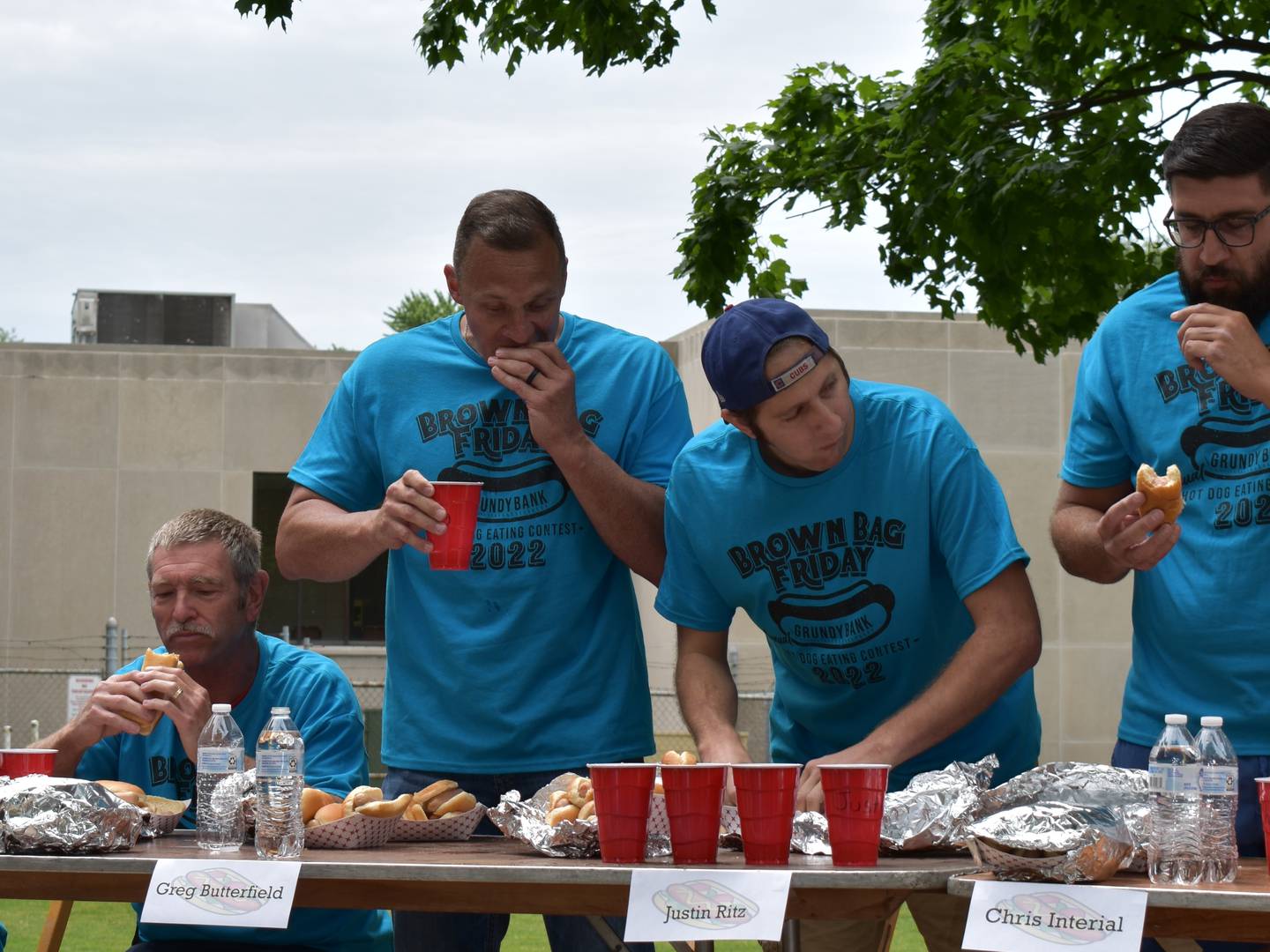 Contestants compete in the annual Grundy Bank hot dog eating contest.