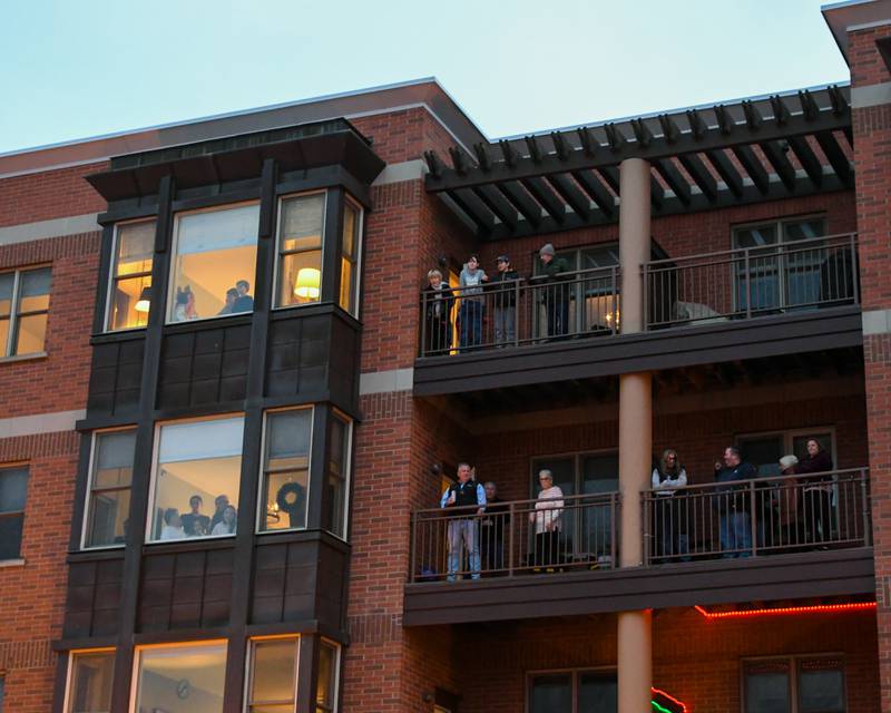 Community members get an elevated view of the Christmas tree lighting ceremony on Friday Nov. 29, 2024, held in downtown Downers Grove.