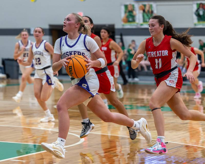 Brynley Glade (13) of Serena drives for layup on Monday, November 17, 2025 at Seneca High School in Seneca.