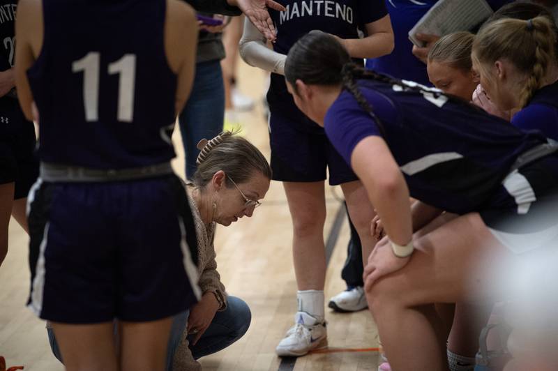 Manteno's head girls coach Bethany Stritar, center, talks with her team during a time out in the Beecher Fall Classic on Tuesday, November 18, 2025.