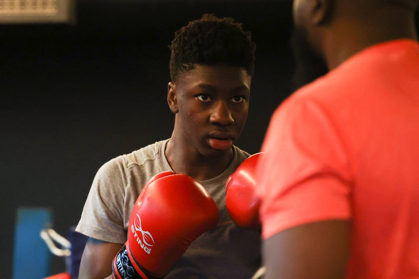 Joseph “Jojo” Awinongya, 15 years-old, trains with his father Joseph at Chicago Sports & Fitness on Tuesday, February 14th.