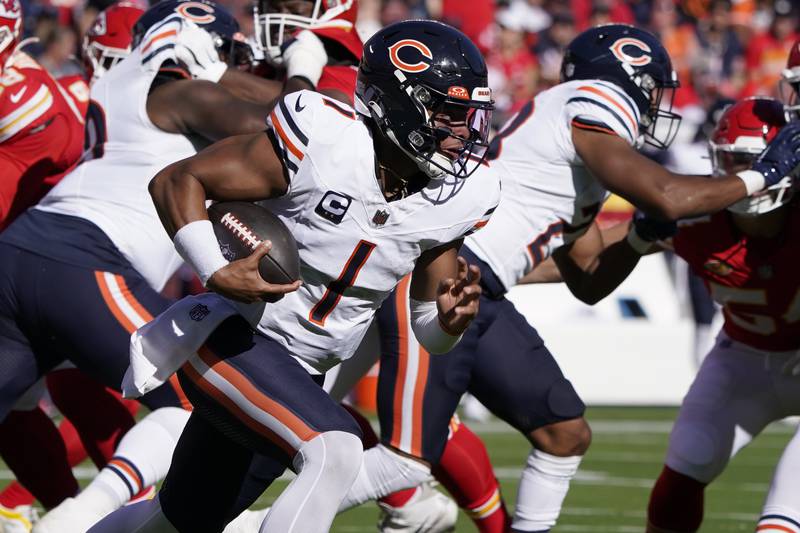Chicago Bears quarterback Justin Fields runs with the ball during the first half against the Kansas City Chiefs Sunday, Sept. 24, 2023, in Kansas City, Mo.