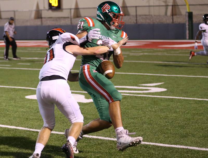Metamora's Shae Seals knocks the ball away from L-P's Josh Senica on a incomplete pass on Friday, Sept. 1, 2023 at Howard Fellows Stadium.