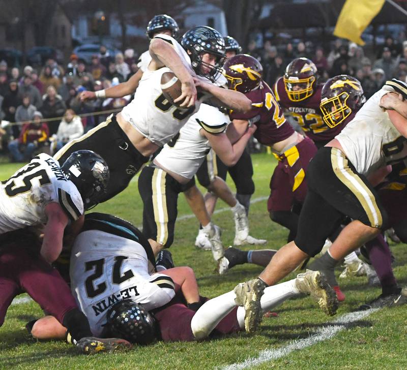 Lena-Winslow's Aiden Wild (85) dives toward the goal line for a touchdown against Stockton in 1A semifinal action in Stockton on Saturday, Nov. 22, 2025.