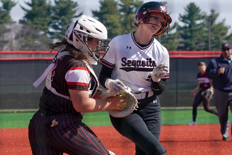 Yorkville's Kayla Kersting (left), tags Antioch's Tegan Schuler for an out during a nonconference softball game at Yorkville High School on Saturday, April 12, 2025.