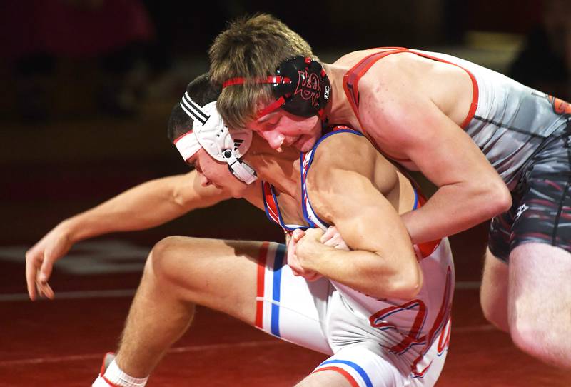 Polo's Tyler Webster and Fulton's Liam Sullivan wrestle at 144 pounds during a triangular meet at Oregon High School on Thursday, Dec. 4, 2025.