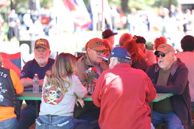 A group of veterans hang out under a tent at the 11th Annual Operation Firm Handshake Veteran’s Picnic on Saturday, Sept. 7, 2024 in Coal City.