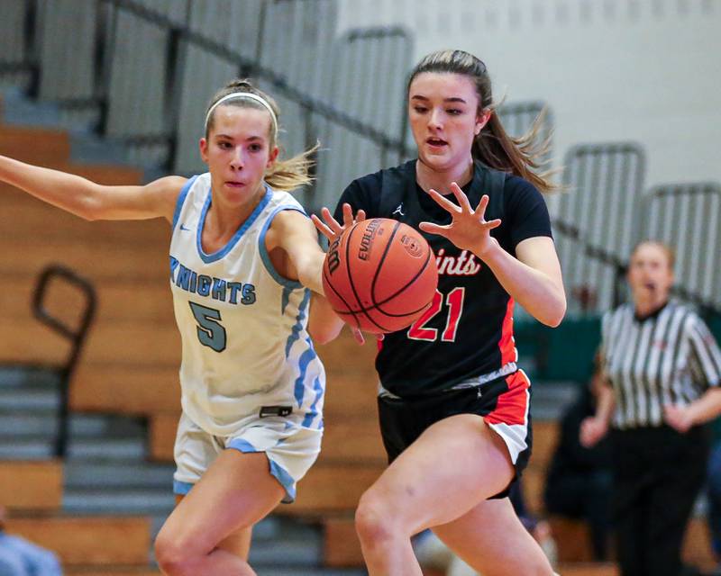 St Charles East's Sofia O’sullivan (21) battles Prospect's Colleen Shute (5) for possession at the York Thanksgiving Tournament. Nov 13, 2023.