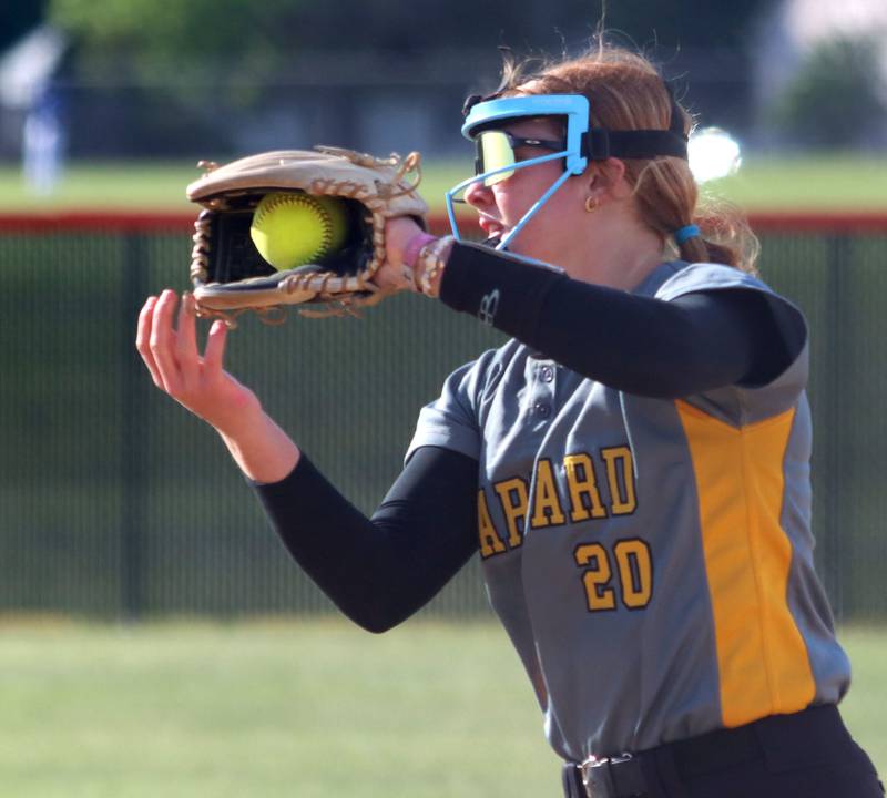 Harvard’s Leona Eichholz snags an infield popup in varsity softball at Crystal Lake Central High School in Crystal Lake on Monday, May 19, 2025.