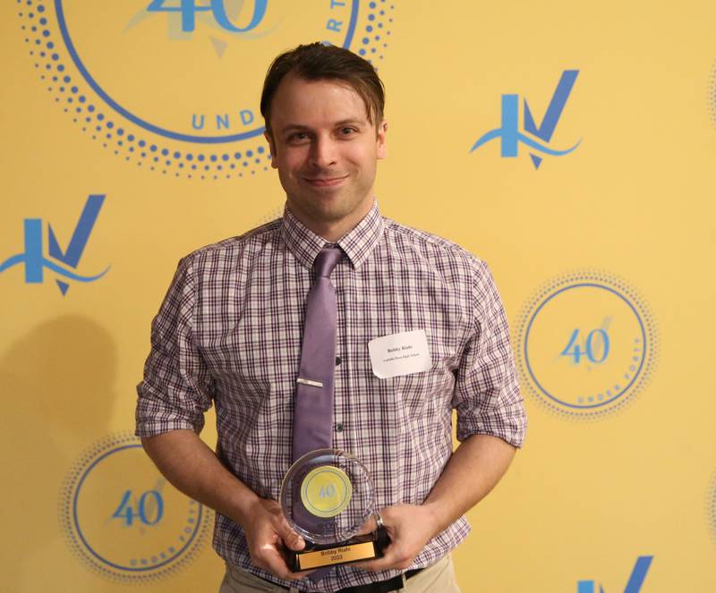Bobby Riahi poses for a photo with his award during the 40 Under Forty awards banquet on Thursday, March 21, 2024 at Westclox in Peru.