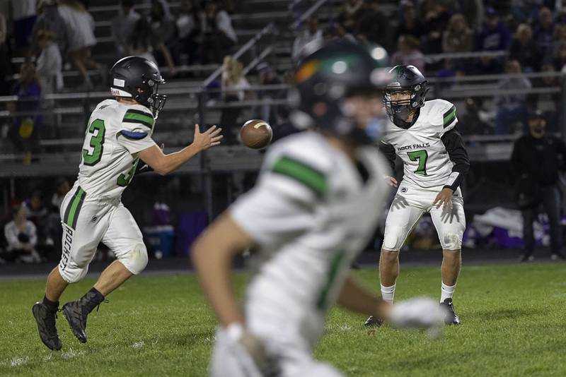 Rock Falls’ Vincent Lombardo tosses the ball to Ryan McCord Friday, Oct. 21, 2022 against Dixon.