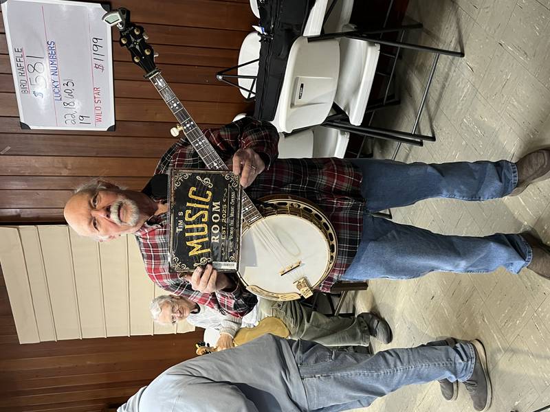 Banjo player Tim Laurence is a frequent presence at First Fridays. He provides instrumental accompaniment to many other performers and was awarded a plaque at the last show, in honor of his contributions.