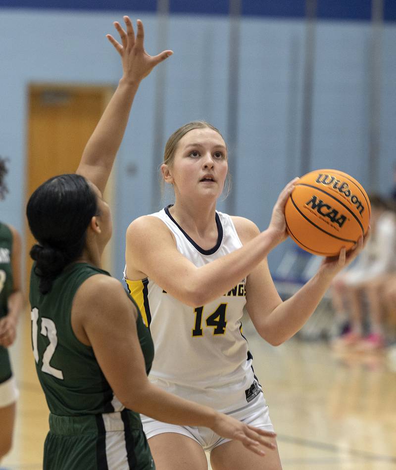 Yorkville Christian’s Taylor Vugteveen looks to shoot over against St. Edward’s Madeline Sasis Tuesday, Feb. 25, 2025, in the Class 1A Sectional at Hinckley-Big Rock.