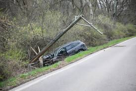 Car crashes into utility pole in Woodstock, shutting down road