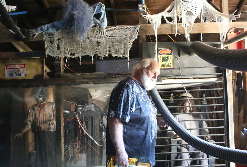 Volunteer Dave Mead walks through the Nightmare on Fairgrounds Road Haunted Attraction on Wednesday, Sept. 25, 2024 at the Bureau County Fairgrounds in Princeton. Mead is the organizer for the haunted attraction.