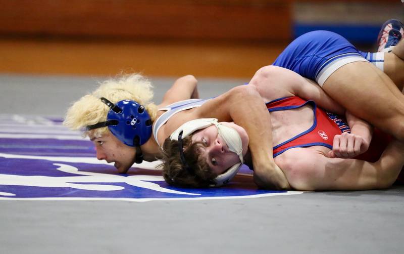 Princeton's Kaydin Gibson looks for a pin against Morrison Thursday night at Prouty Gym.