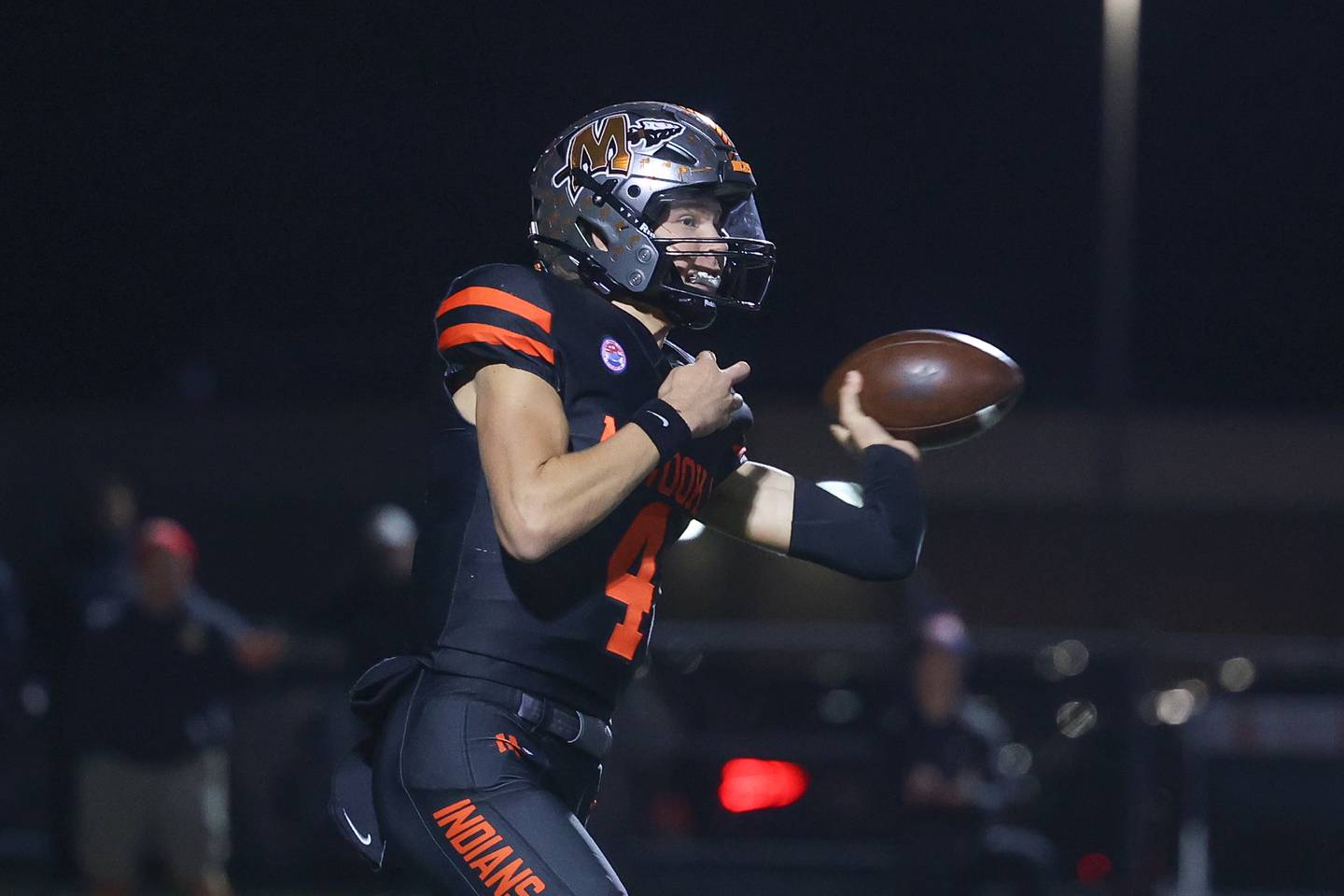Minooka’s Zane Caves side arms a pass against Lincoln-Way East on Friday, Nov. 8, 2024 in Minooka.