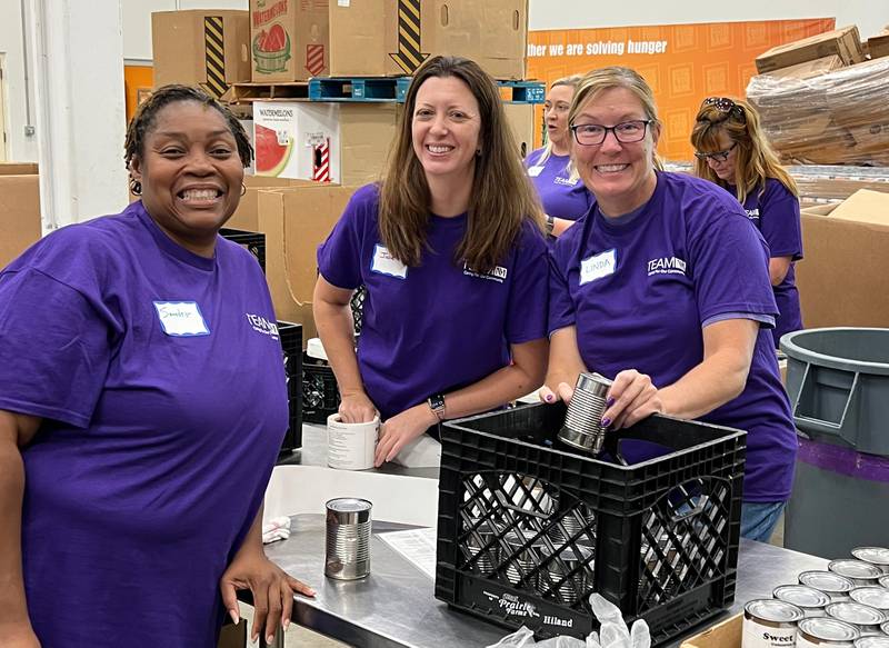 Pictured (L to R): Sandra Gogins, Julie Schiltz and Linda Pupillo help sort canned goods at the Northern Illinois Foodbank during a Team NM initiative organized by Northwestern Medicine’s Physicians Relations team.