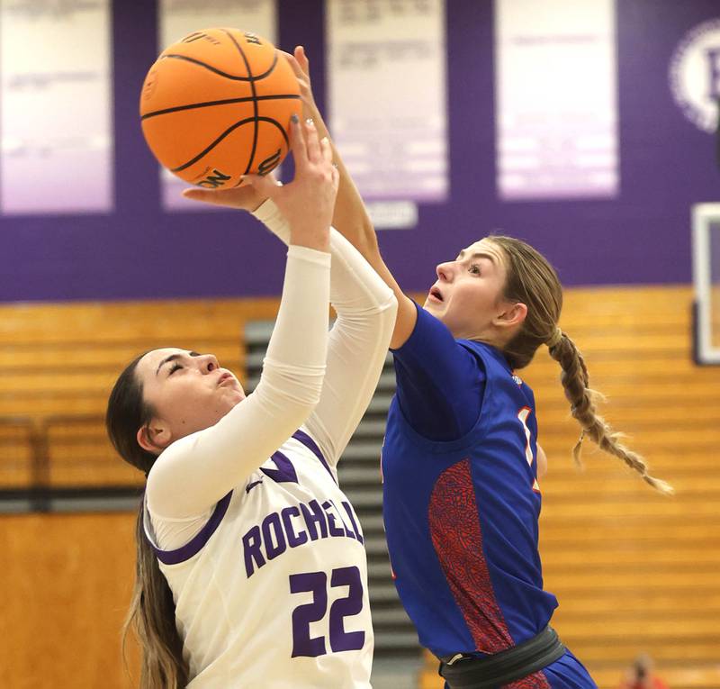 Rochelle's Gianna Olguin and Genoa-Kingston's Presley Meyer go after a rebound during their game Monday, Dec. 15, 2025, at Rochelle High School.