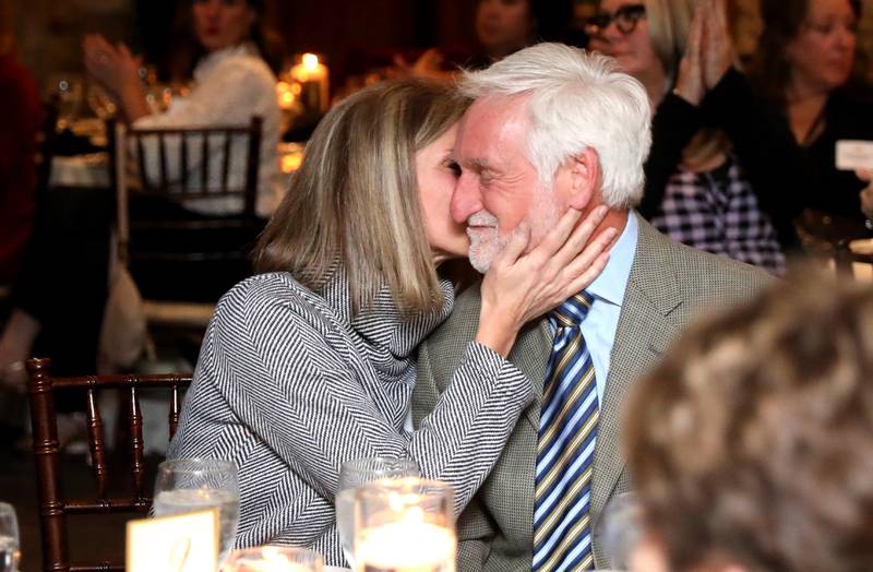 Jay Womack is congratulated by his wife, Sheree, after he was named the 2022 Wood Award winner by the Geneva Chamber of Commerce during the chamber’s annual dinner and awards at Riverside Receptions in Geneva on Wednesday, Nov. 16, 2022.