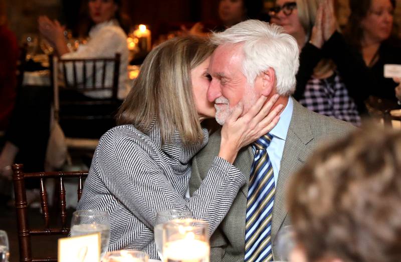 Jay Womack is congratulated by his wife, Sheree, after he was named the 2022 Wood Award winner by the Geneva Chamber of Commerce during the chamber’s annual dinner and awards at Riverside Receptions in Geneva on Wednesday, Nov. 16, 2022.
