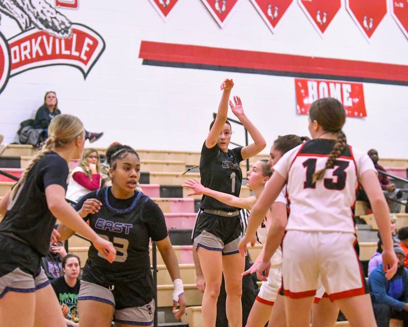 Oswego East's Aubrey Lamberti (1) takes a shot during the game on Thursday Dec. 18, 2025, while traveling to take on Yorkville High School.
