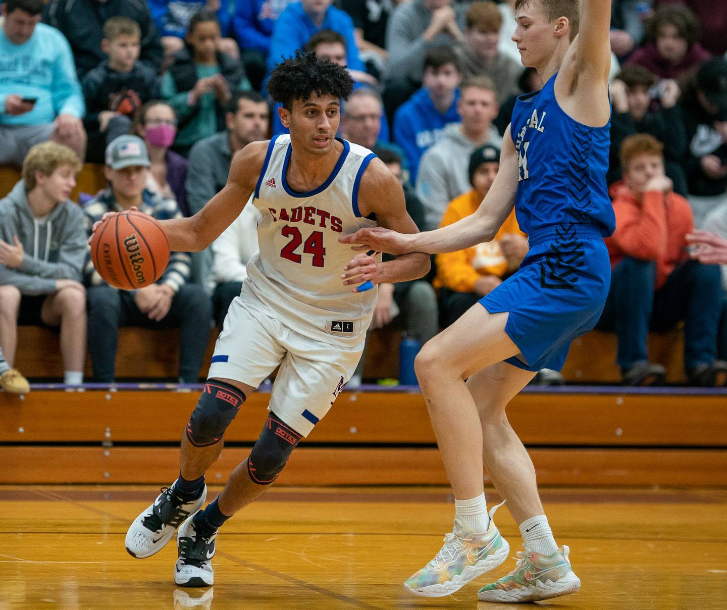 Marmion’s Trevon Roots (24) drives the baseline against Burlington Central's Andrew Scharnowski (21) during the 59th Annual Plano Christmas Classic basketball tournament championship game at Plano High School on Friday, Dec 30, 2022.