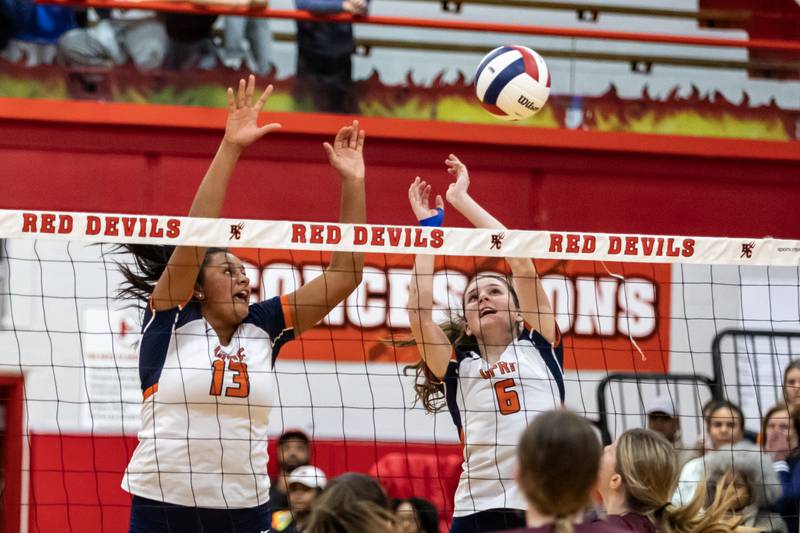Oak Park-River Forest's Jaida Garland and Devyn Kleidon attempt to block during a 4A Supersectional girls volleyball game against Lockport at Hinsdale Central on Nov. 10, 2025.