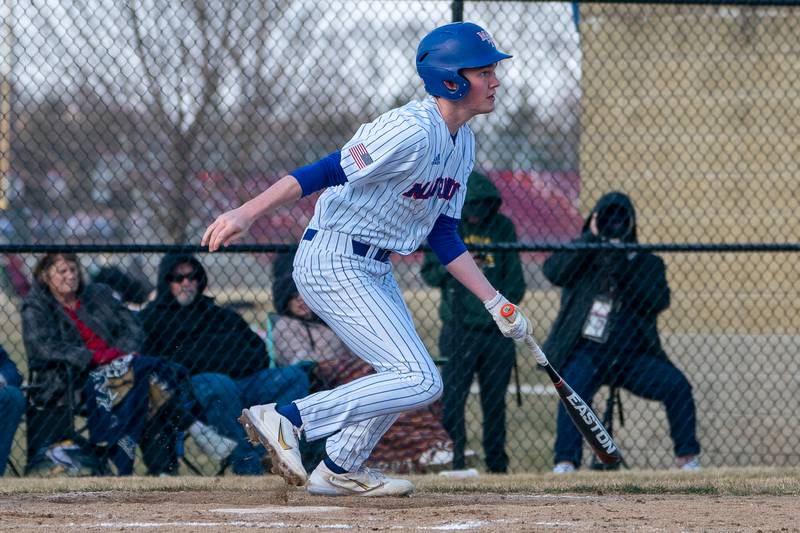 Marmion's Luke O'Connor (4) singles against Yorkville during a baseball game at Marmion High School in Aurora on Tuesday, Mar 28, 2023.