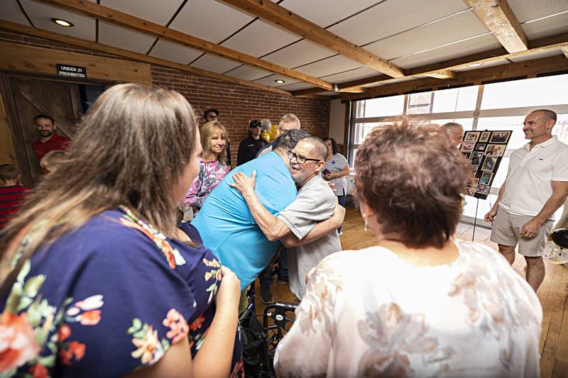 Hugs were prevalent as well-wishers celebrate Merlin’s 70th Sunday, Sept. 17, 2023 at Champs in Sterling.
