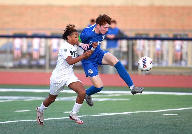 Glenbard West’s Catino Harris, Jr. (left) and Geneva’s Reece Leonard go after the ball during the Class 3A St. Charles North Sectional semifinal on Tuesday, Oct. 29, 2024 in St. Charles.