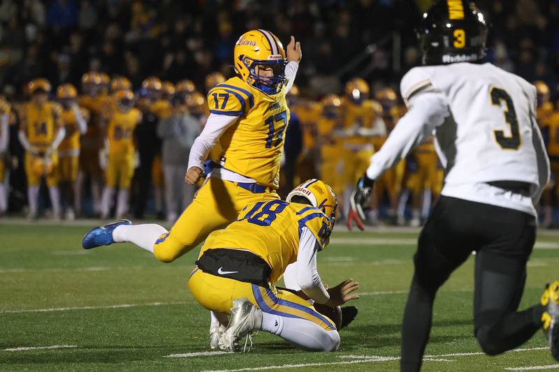Lyons Township’s AJ Vavrik kicks a field goal to put the Lions on the board first against Joliet West in the first round of the playoffs on Friday, Nov. 1, 2024 in La Grange.