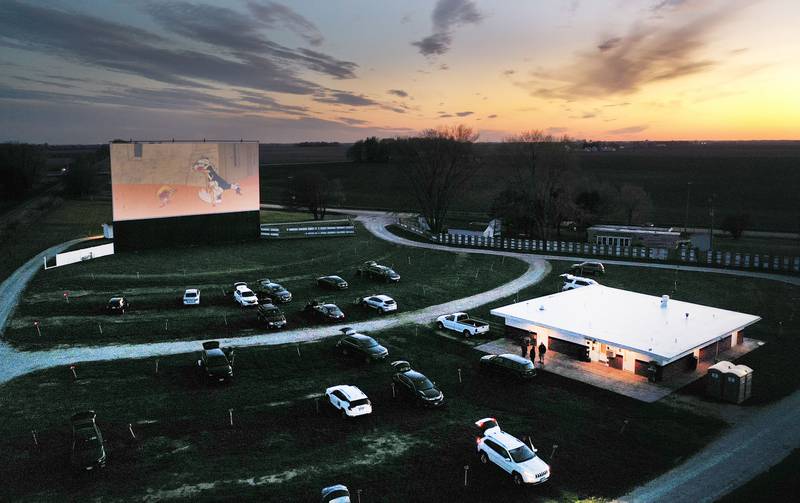 The sun sets over the Route 34 Drive-in on Friday, April 19, 2024 in Earlville. The Drive-In theater opened for the season this weekend.