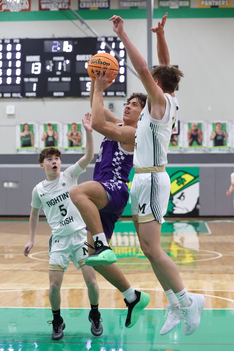 Wilmington's Hunter Kaitschuck goes for a layup under pressure during Bishop McNamara's 61-24 victory over Wilmington in the IHSA Class 2A Seneca Sectional semifinal on Tuesday, March 3, 2026.