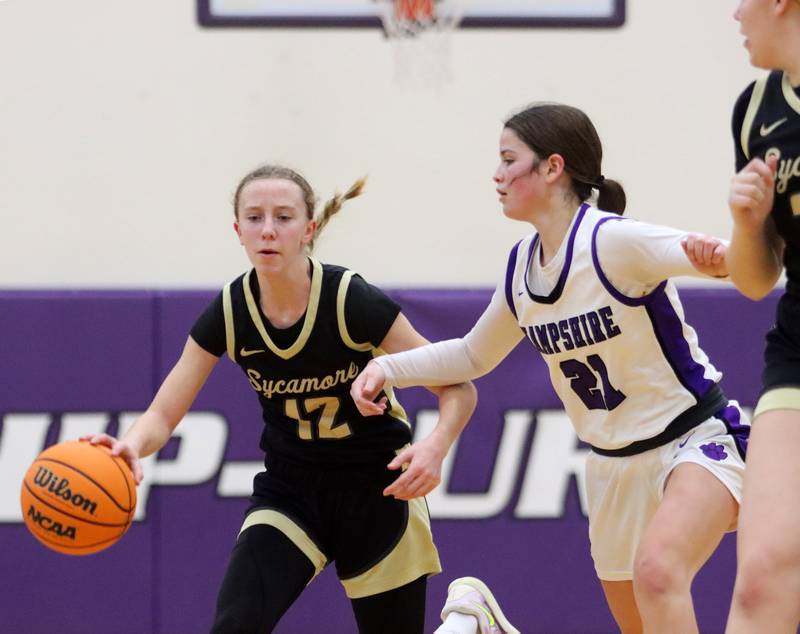 Hampshire’s Roni Dumoulin, right, guards Sycamore’s Sadie Lang in varsity girls basketball on Friday, Jan. 3, 2025, at Hampshire High School in Hampshire.