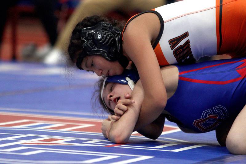 McHenry’s Bianca Mangadialan, top, battles Dundee-Crown’s Elisa Martin in a 115-pound bout in girls varsity wrestling at Carpentersville Thursday night.