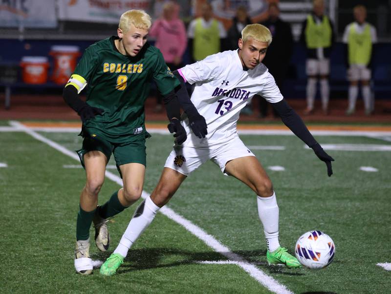Mendota's Sebastian Carlos tries to hold off Coal City's Luke Munsterman Thursday, Nov. 6, 2025, during their Class 1A state semifinal game at Hoffman Estates High School.